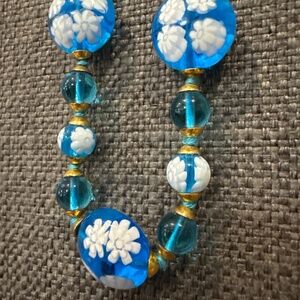 Artisan glass necklace with white flowers and aqua blue glass